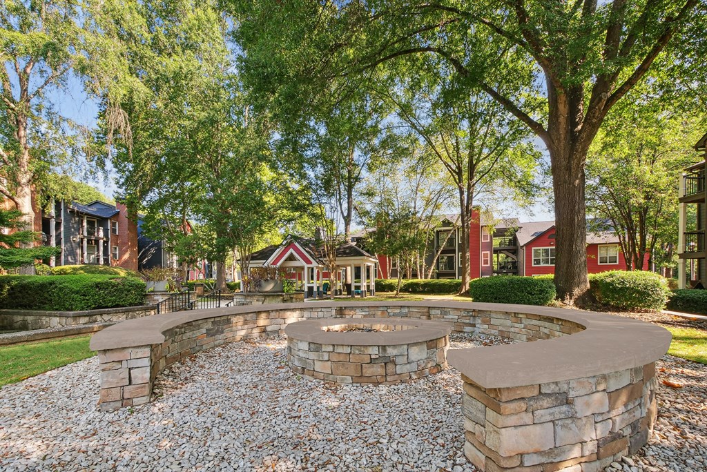 A stone wall with a circular opening in the middle.